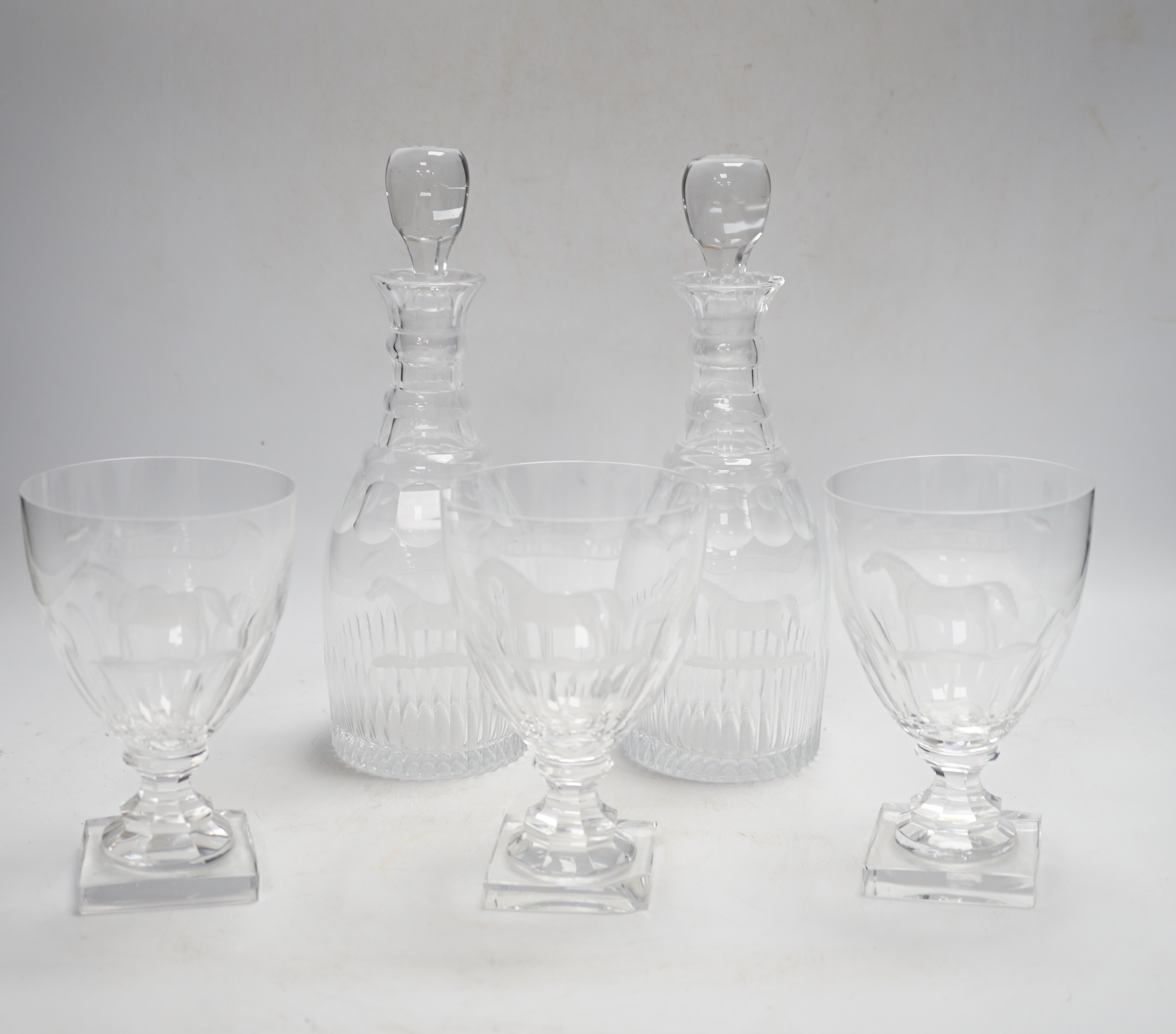 A suite of George III-style drinking glassware, consisting of a pair of decanters and stoppers and three square based rummers, each engraved with an image of the legendary racehorse, High Flyer, decanters 24.5cm, Please